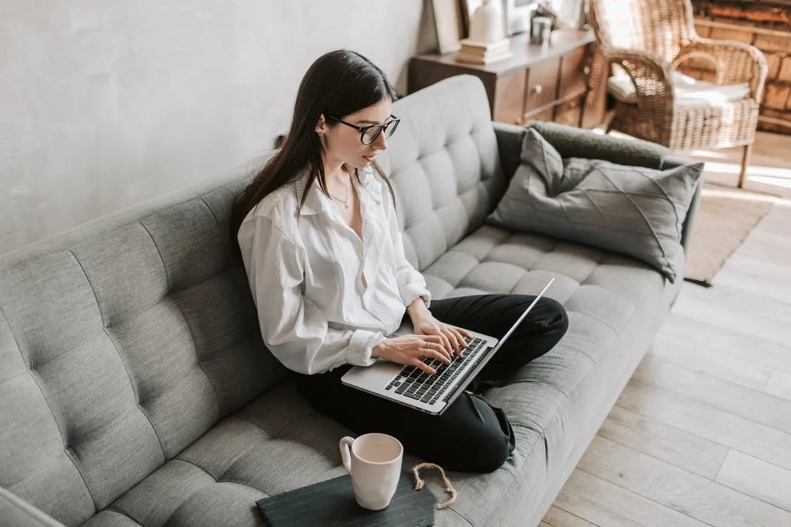 Woman Working At Home Using Laptop Woman Working At Home Using Laptop